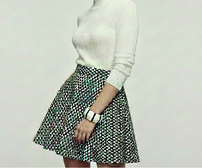 1960s model wearing matching striped jewelry set