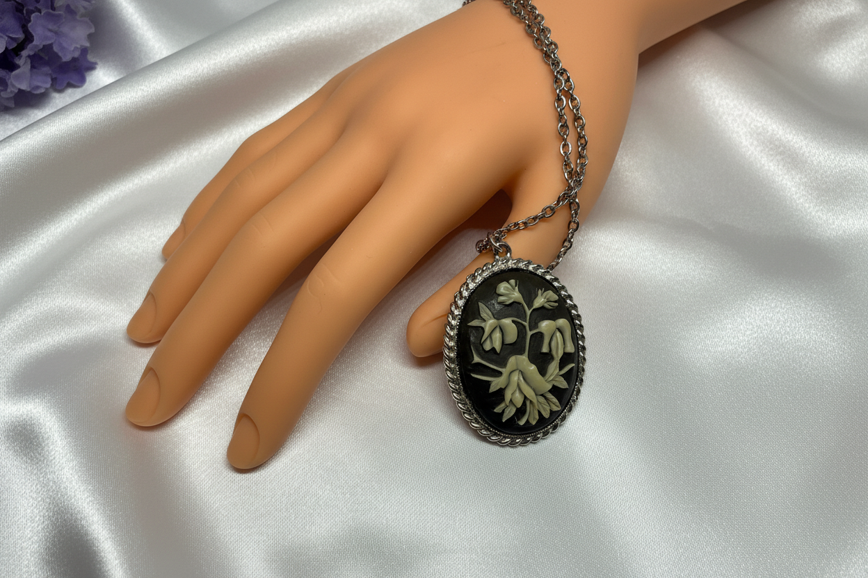 Vintage Black Floral Cameo Brooch on White Satin