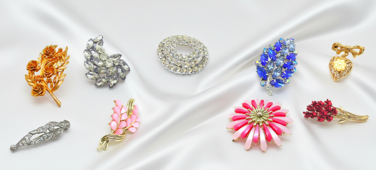 Brooches with light white satin background