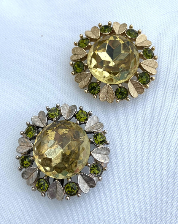 Avon brooches - one silver and one gold
